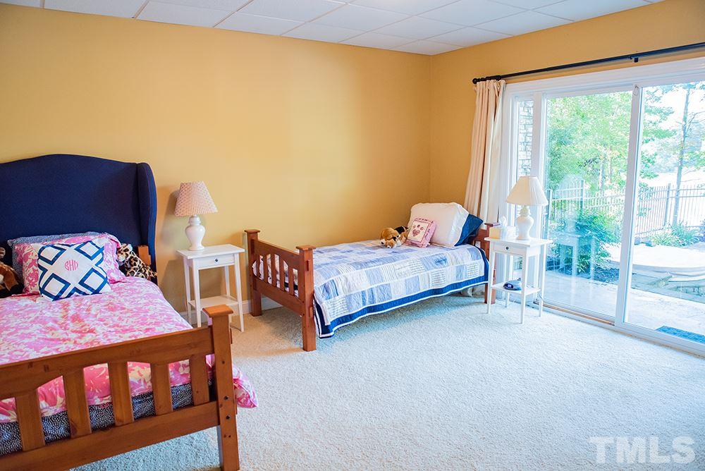 159 Duck Pointe Drive Roxboro, NC 27574 - Photo 26 of 30 a bedroom with a bed with large window