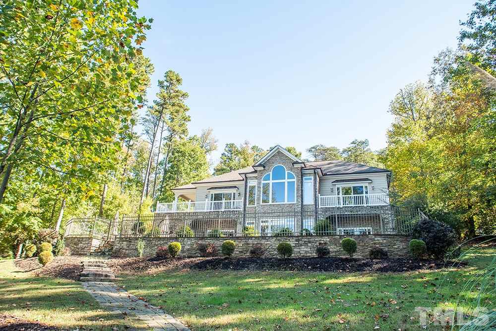 159 Duck Pointe Drive Roxboro, NC 27574 - Photo 29 of 30 a front view of a house with a yard and potted plants