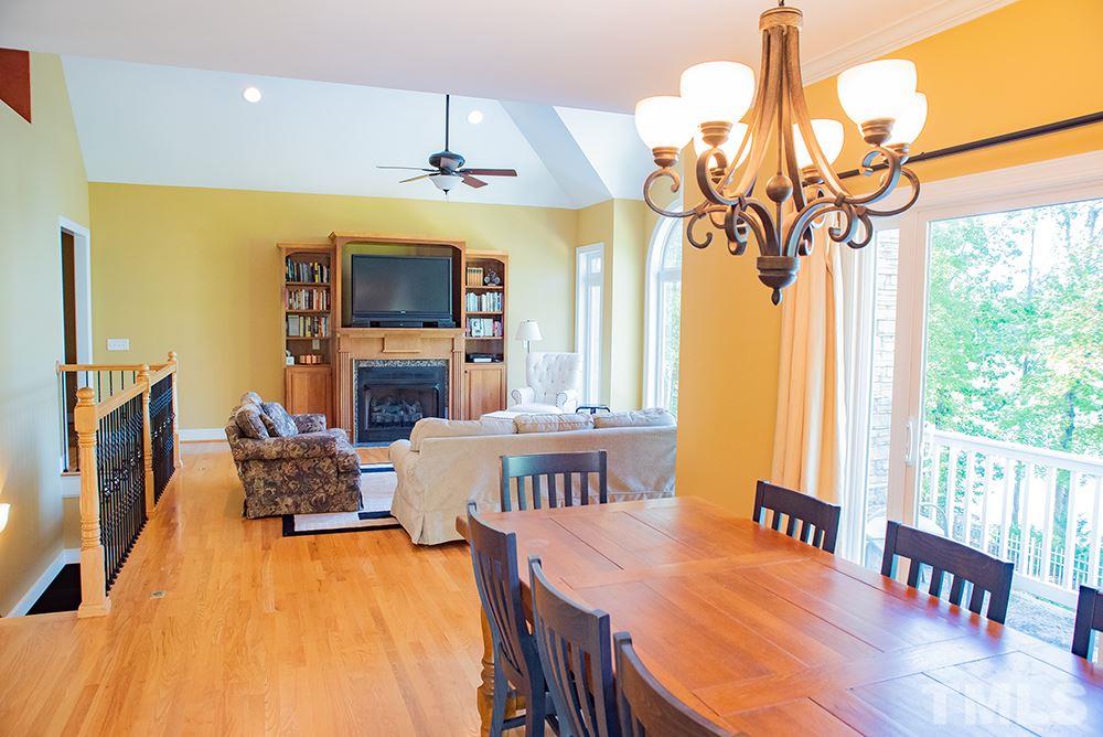 159 Duck Pointe Drive Roxboro, NC 27574 - Photo 9 of 30 a view of a dining room with furniture window and wooden floor