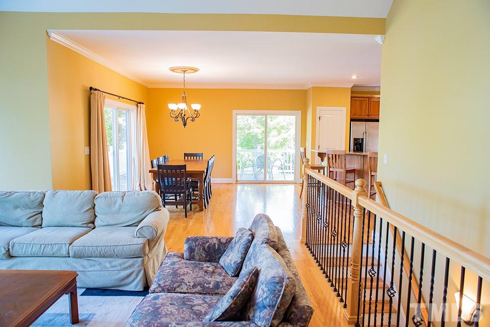 159 Duck Pointe Drive Roxboro, NC 27574 - Photo 10 of 30 a living room with furniture and a chandelier