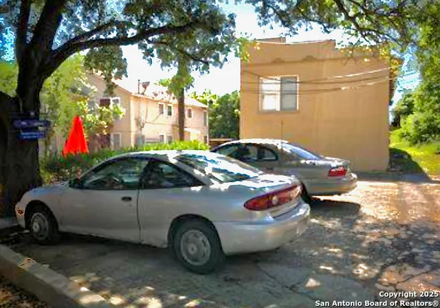 a car parked in front of a house