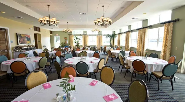 a very nice looking dining room with furniture
