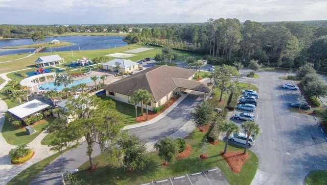 an aerial view of a house with a lake view