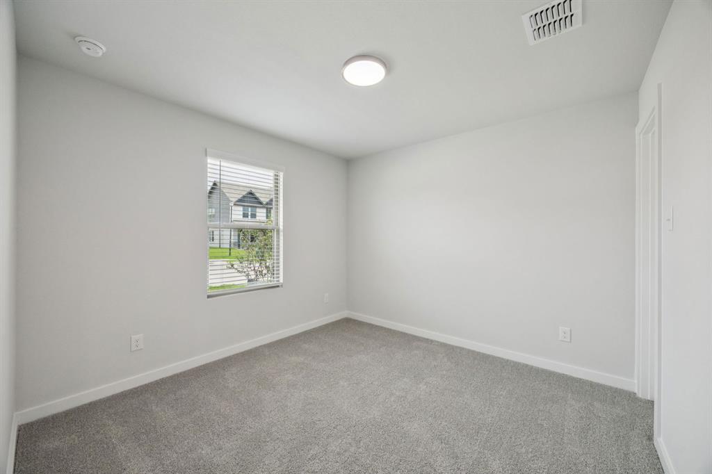 1153 Del Rio Drive Lavon, TX 75166 - Photo 16 of 27 an empty room with windows