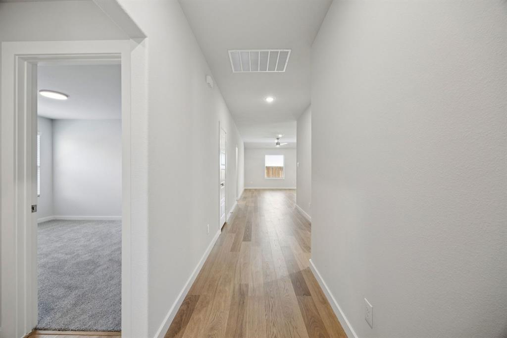 1153 Del Rio Drive Lavon, TX 75166 - Photo 21 of 27 a view of a hallway with wooden floor