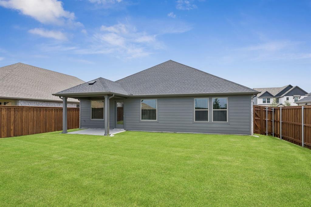 1153 Del Rio Drive Lavon, TX 75166 - Photo 24 of 27 a front view of house with yard and green space