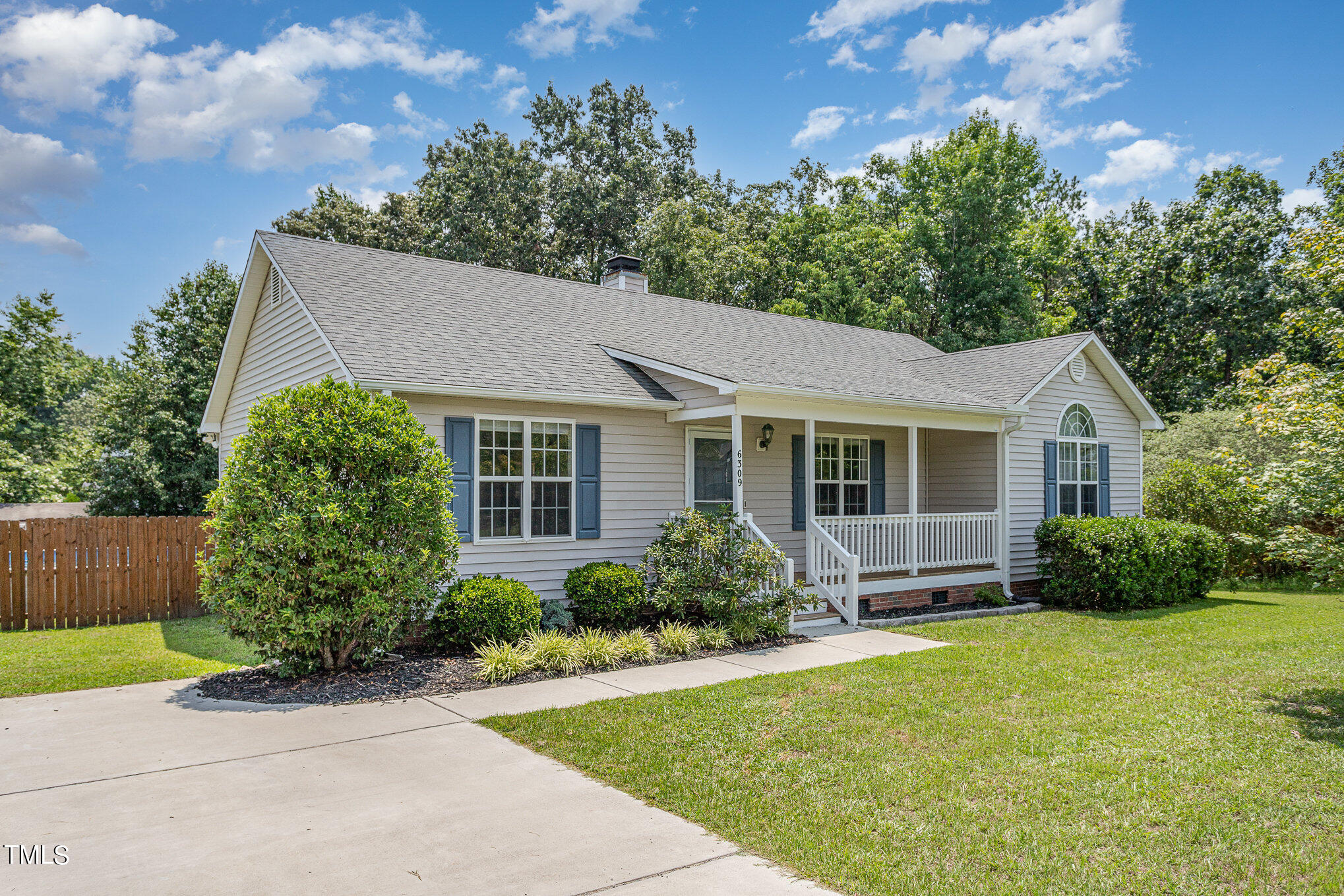 a view of a house with garden and yard