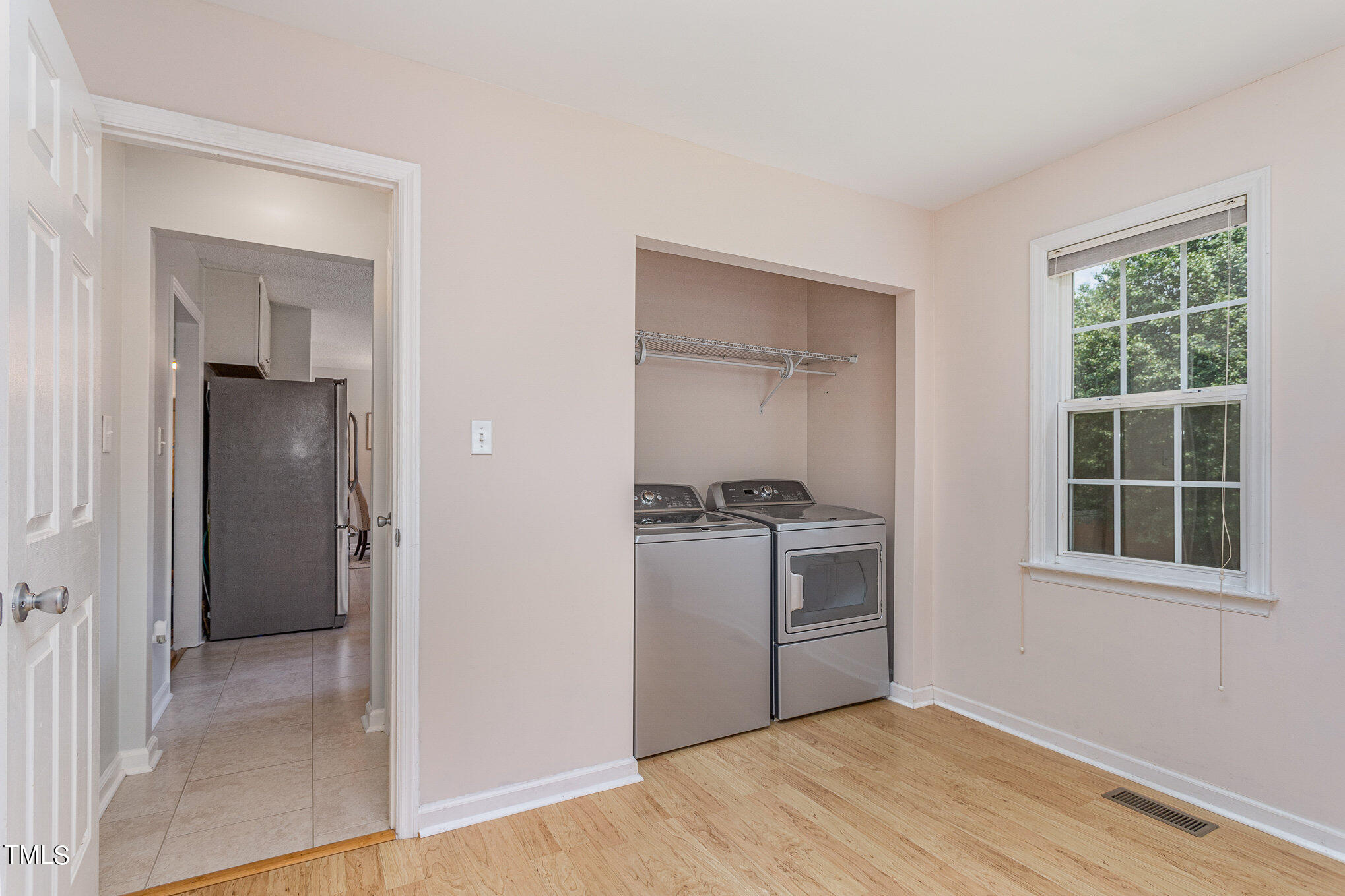 6309 Bridgemont Lane Willow Spring, NC 27592 - Photo 12 of 27 a kitchen with a stove and a refrigerator