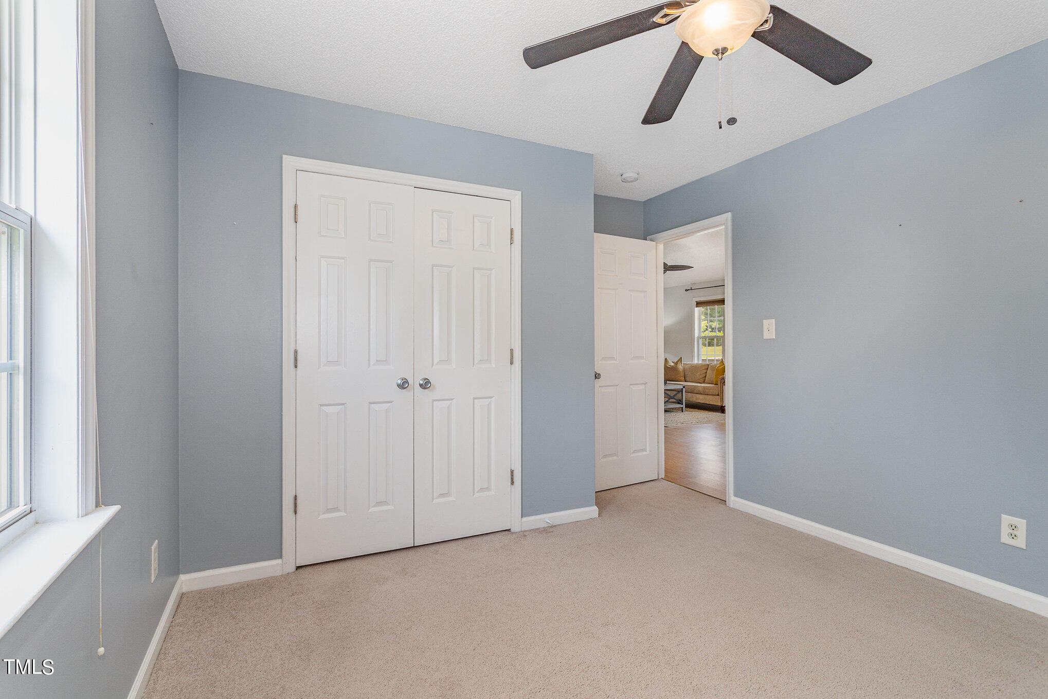 6309 Bridgemont Lane Willow Spring, NC 27592 - Photo 19 of 27 an empty room with chandelier fan