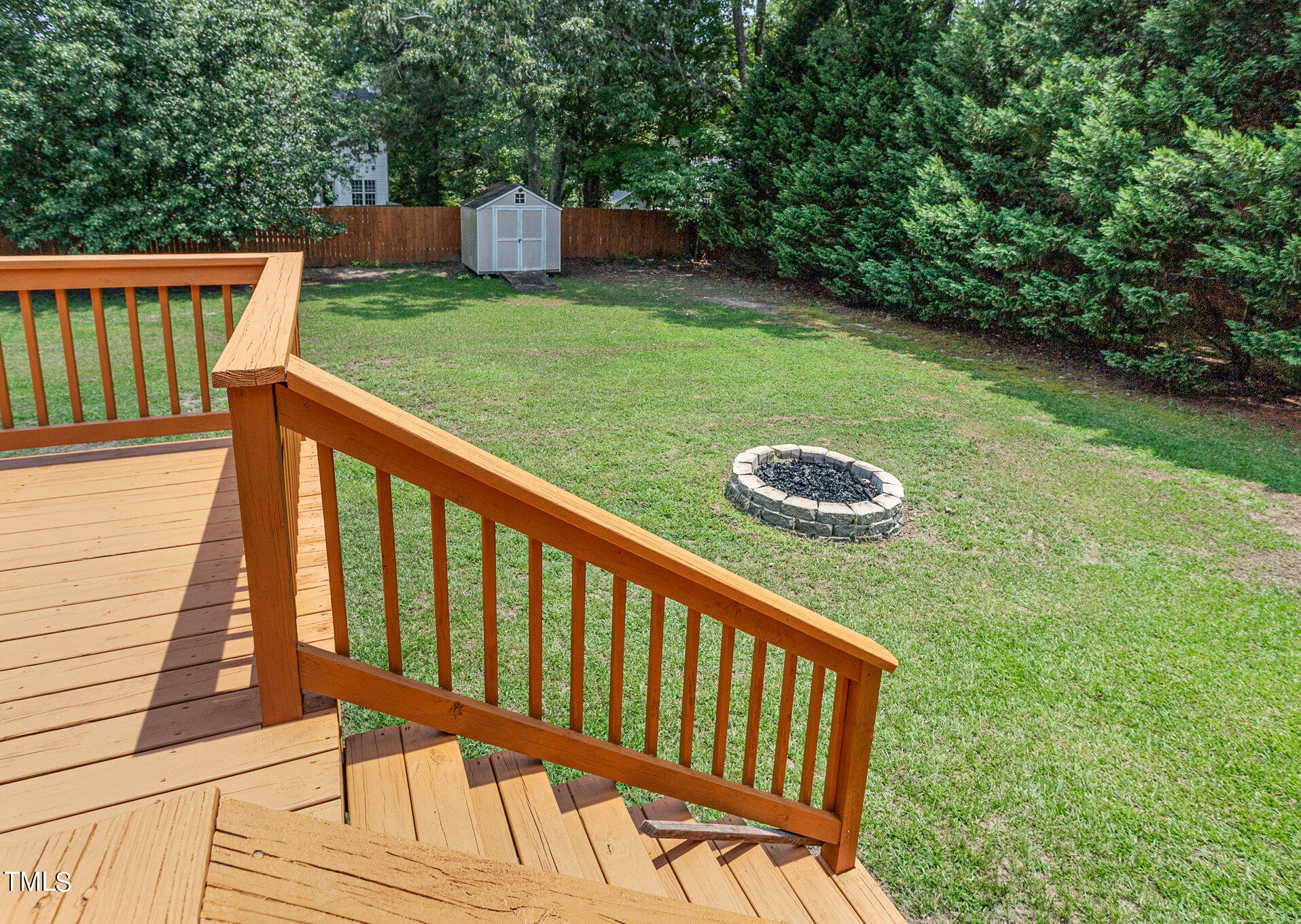 6309 Bridgemont Lane Willow Spring, NC 27592 - Photo 21 of 27 a view of a two chairs and table in the backyard