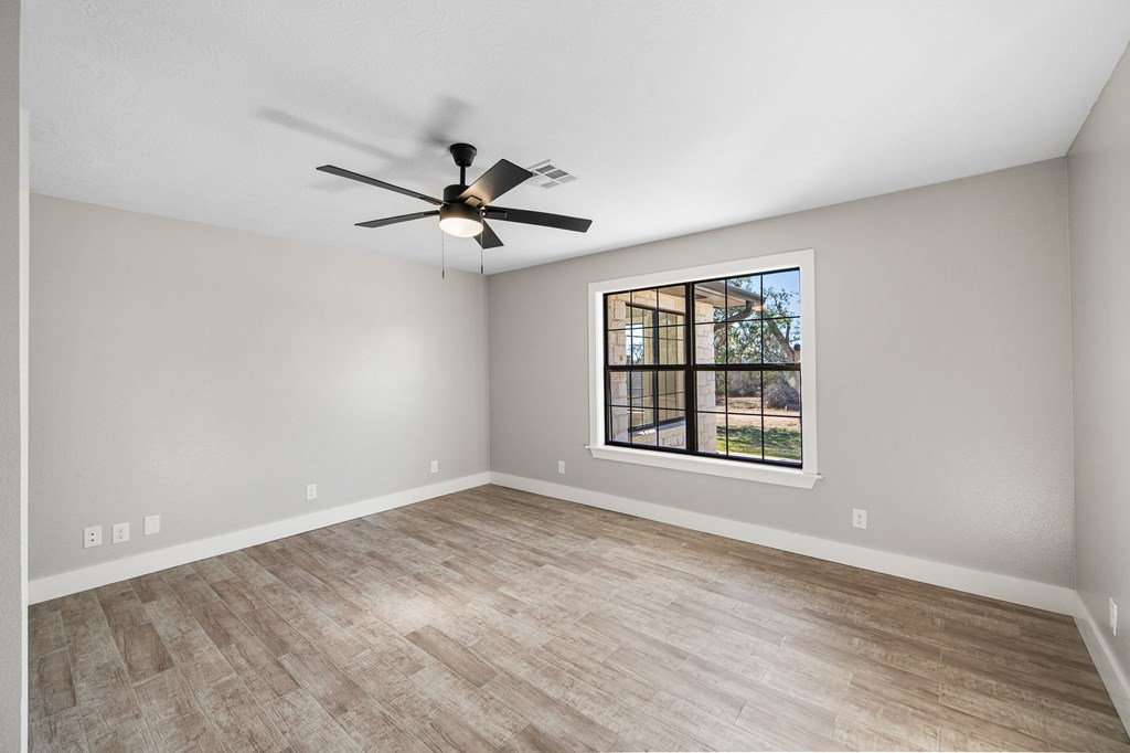 622 Paradise Ranch Road Fredericksburg, TX 78624 - Photo 49 of 90 a view of an empty room with a window
