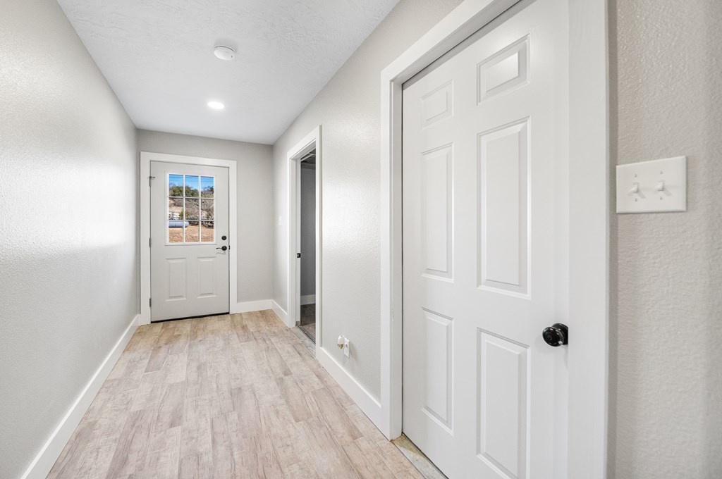 622 Paradise Ranch Road Fredericksburg, TX 78624 - Photo 61 of 90 a view of a hallway with wooden floor