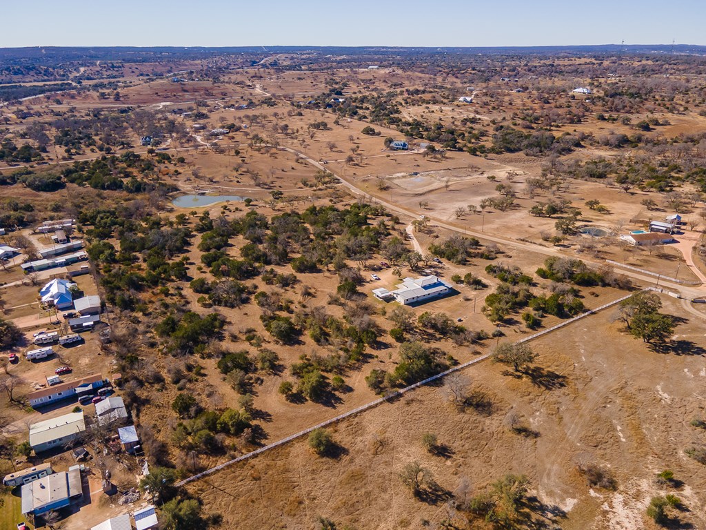 622 Paradise Ranch Road Fredericksburg, TX 78624 - Photo 72 of 90 an aerial view of house with yard and mountain view in back