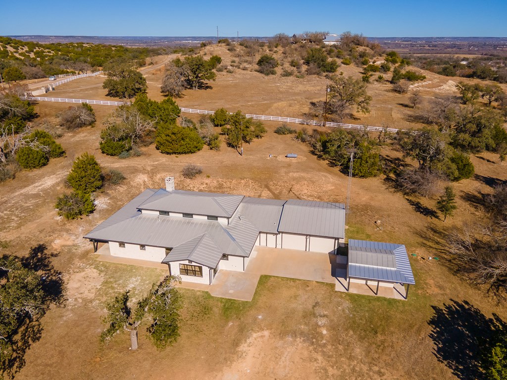 622 Paradise Ranch Road Fredericksburg, TX 78624 - Photo 77 of 90 an aerial view of residential houses with outdoor space