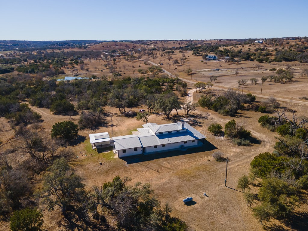 622 Paradise Ranch Road Fredericksburg, TX 78624 - Photo 80 of 90 an aerial view of a house with a yard