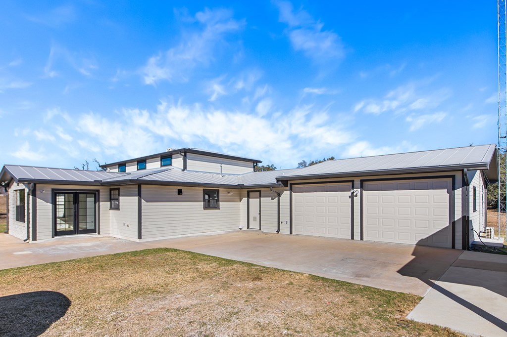 622 Paradise Ranch Road Fredericksburg, TX 78624 - Photo 9 of 90 a front view of a house with a yard