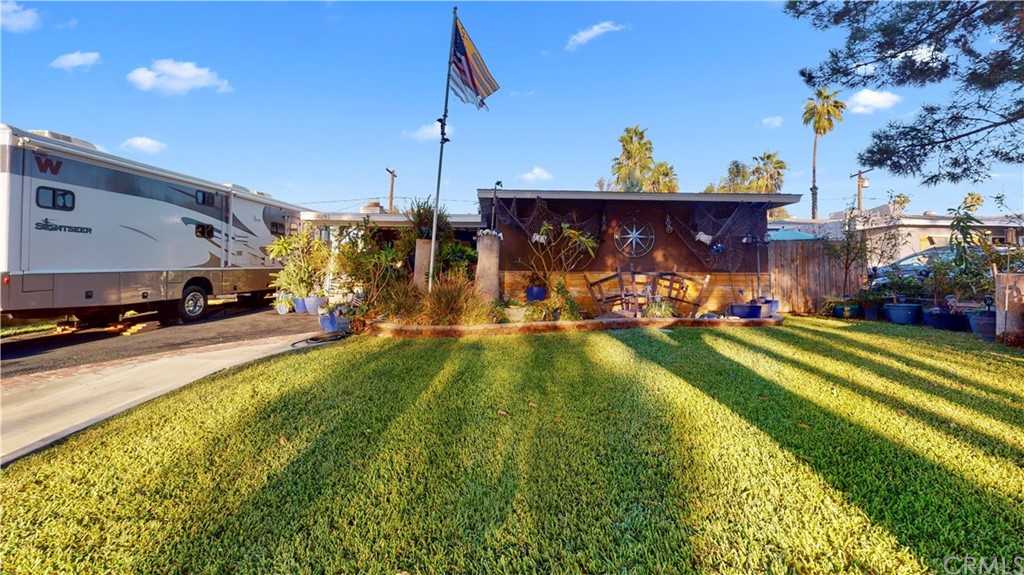 3025 Molly Street Riverside, CA 92506 - Photo 1 of 1 a view of a swimming pool with a yard and a fountain