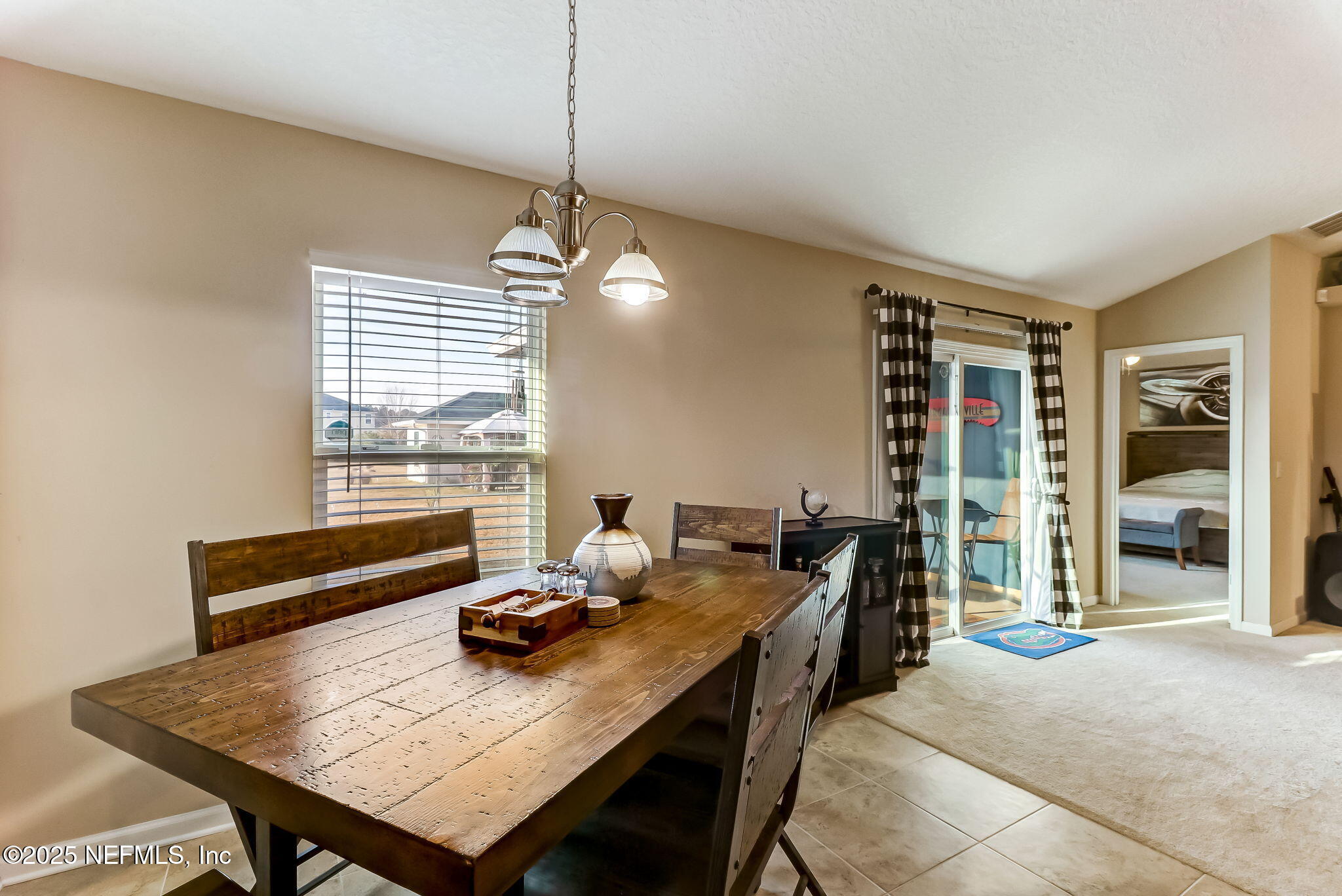 94055 Last Lane Yulee, FL 32097 - Photo 13 of 30 a view of a workspace with furniture and window