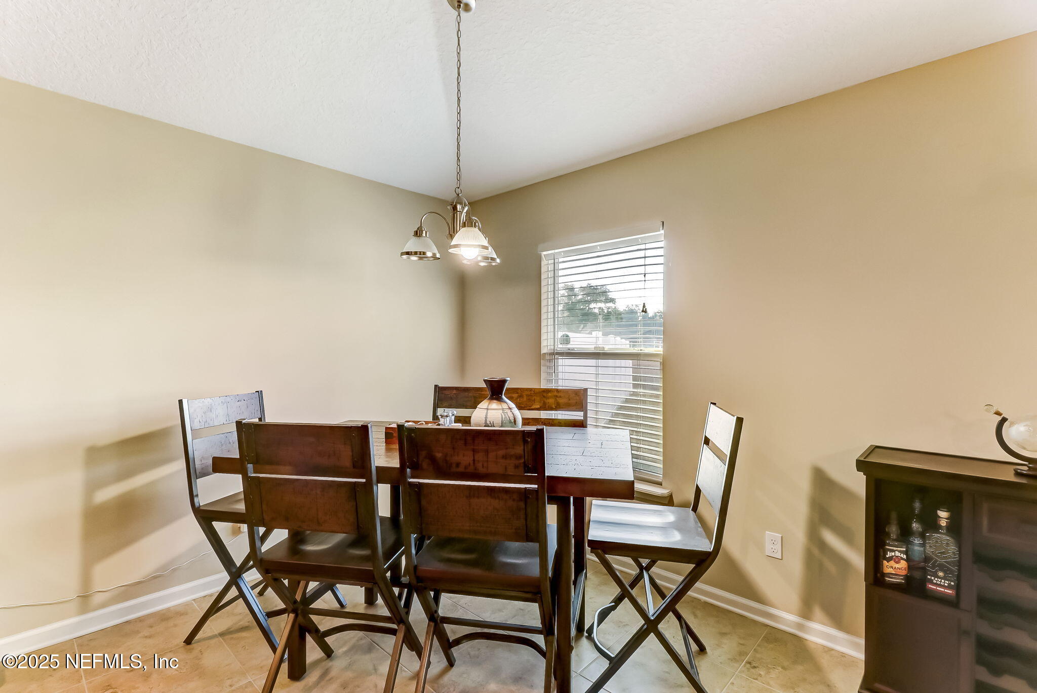 94055 Last Lane Yulee, FL 32097 - Photo 14 of 30 a view of a dining room with furniture window and wooden floor