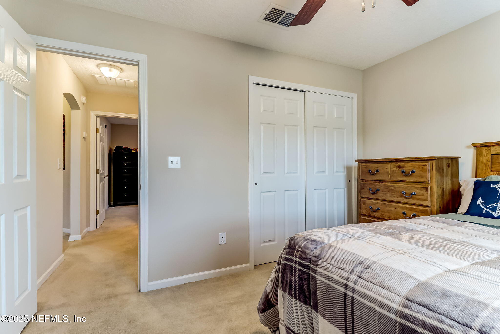 94055 Last Lane Yulee, FL 32097 - Photo 20 of 30 a bedroom with a bed and a closet