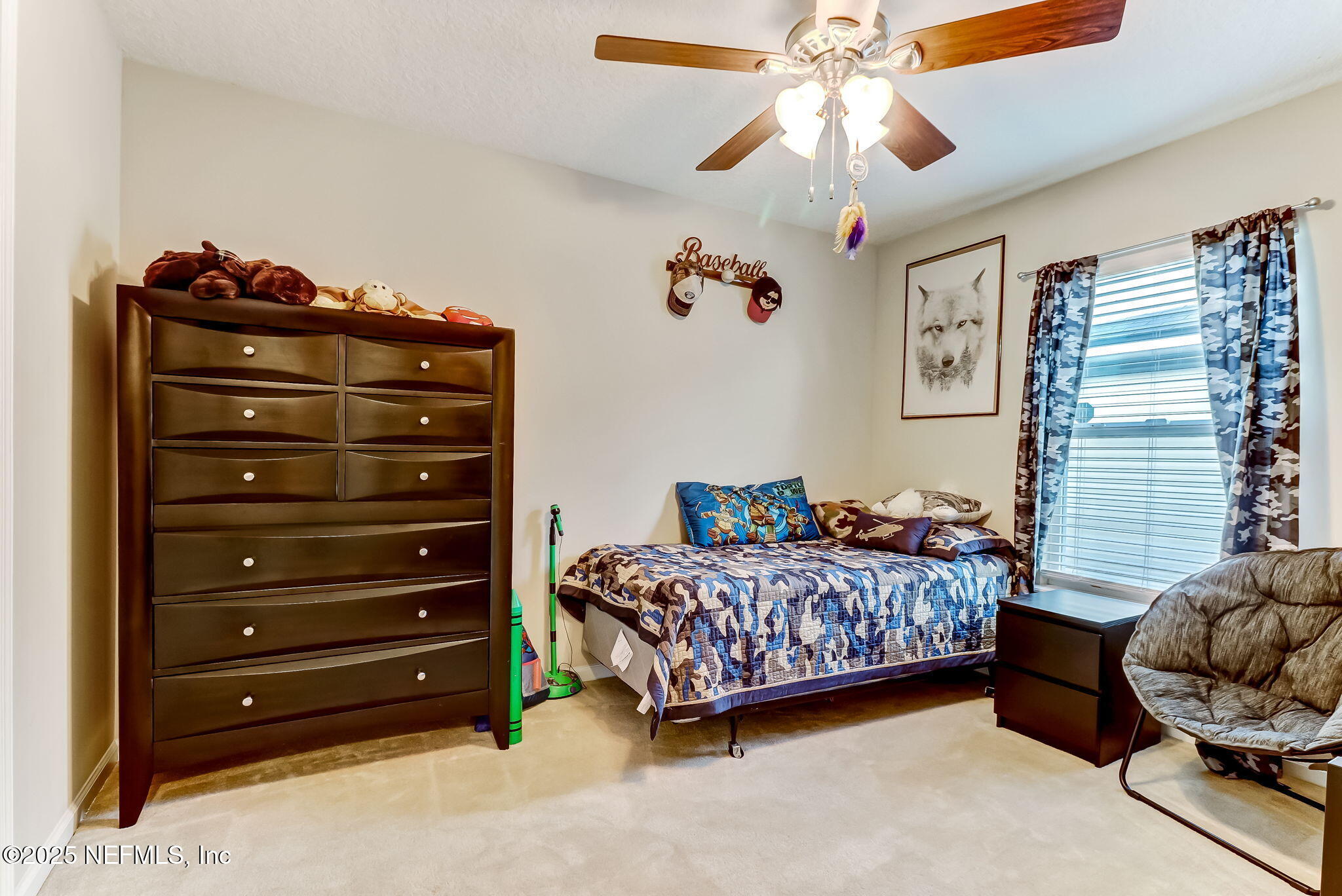 94055 Last Lane Yulee, FL 32097 - Photo 22 of 30 a bedroom with a bed and a chandelier