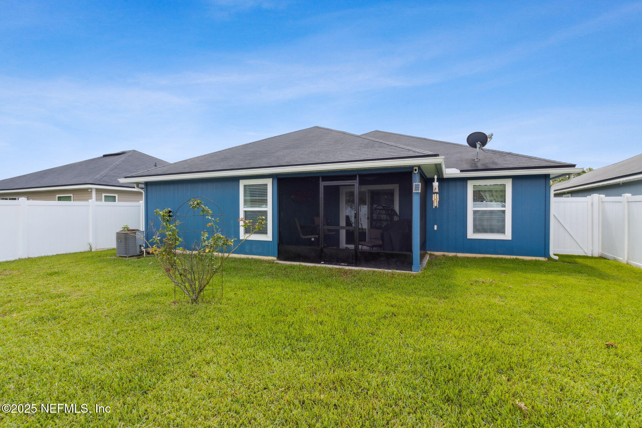 94055 Last Lane Yulee, FL 32097 - Photo 24 of 30 a view of a house with a yard and garage