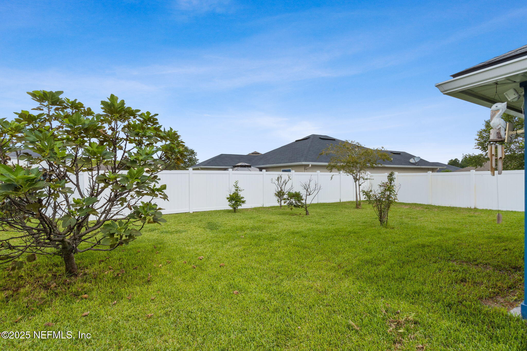 94055 Last Lane Yulee, FL 32097 - Photo 27 of 30 a view of a house with garden and a yard