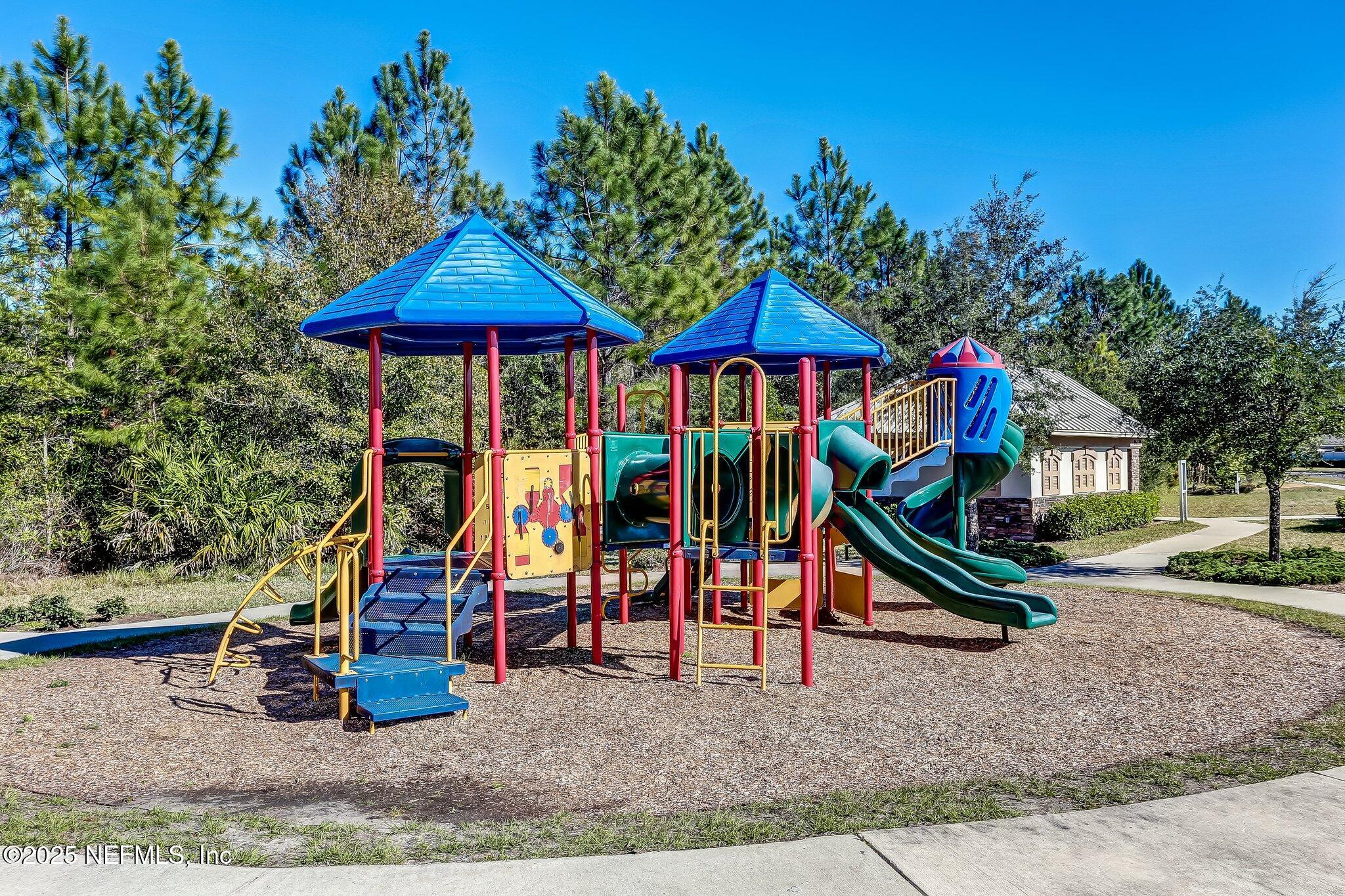 94055 Last Lane Yulee, FL 32097 - Photo 30 of 30 a view of outdoor space with swings
