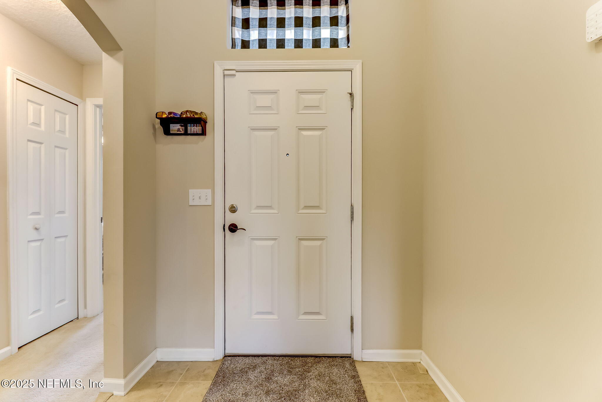 94055 Last Lane Yulee, FL 32097 - Photo 7 of 30 a view of a hallway with closet