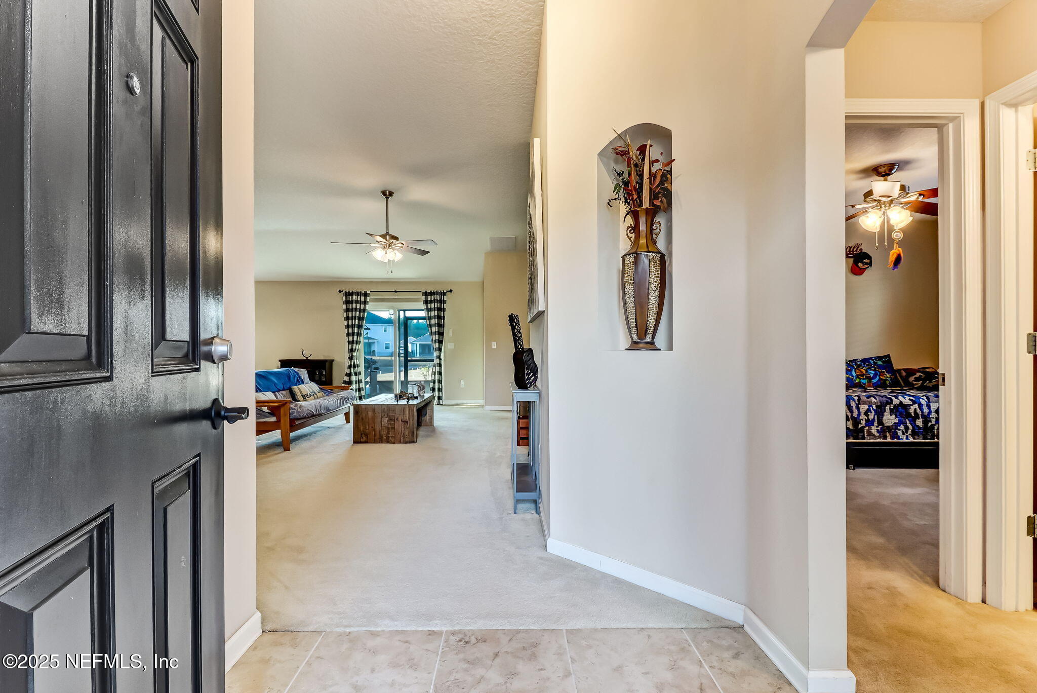 94055 Last Lane Yulee, FL 32097 - Photo 8 of 30 view of living room with furniture and large mirror