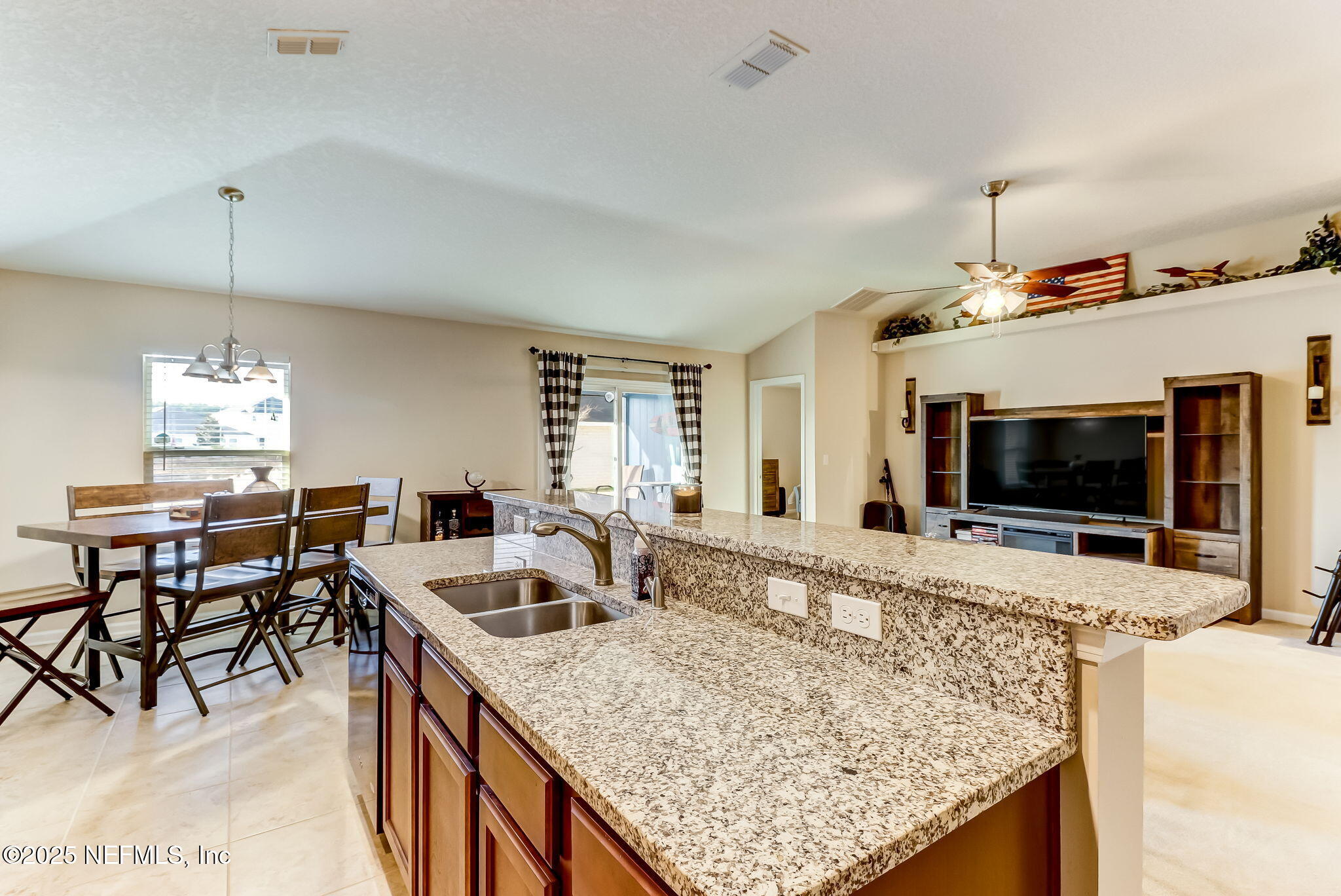94055 Last Lane Yulee, FL 32097 - Photo 9 of 30 a view of living room kitchen and dining area