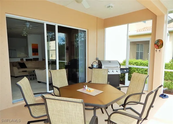 a view of an outdoor dining space with a table and chairs
