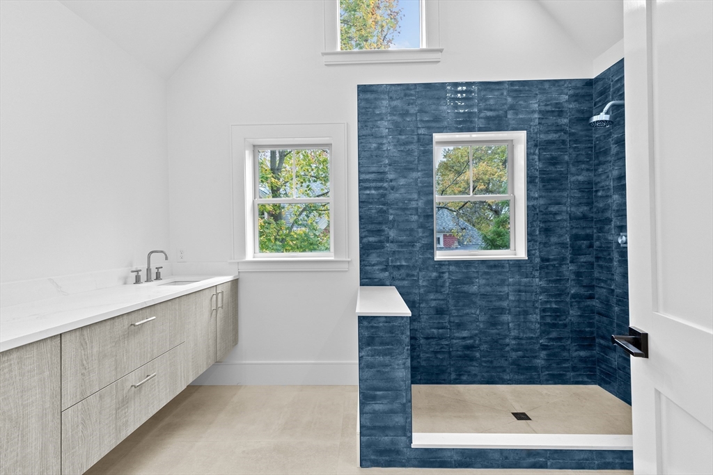 90 Addington Road, Unit 1 Brookline, MA 02445 - Photo 14 of 21 a bathroom with a sink a window and a shower