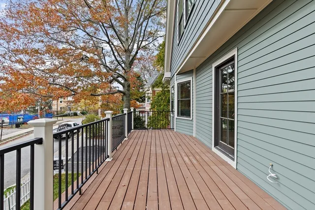 a view of backyard with a deck