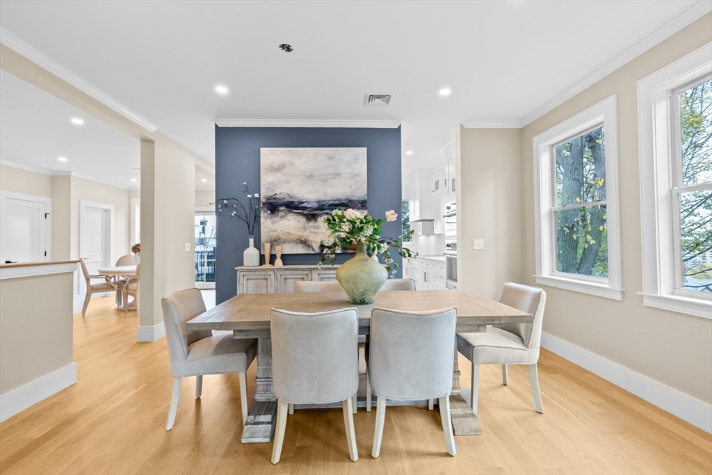 90 Addington Road, Unit 1 Brookline, MA 02445 - Photo 6 of 21 a view of a dining room with furniture window and wooden floor