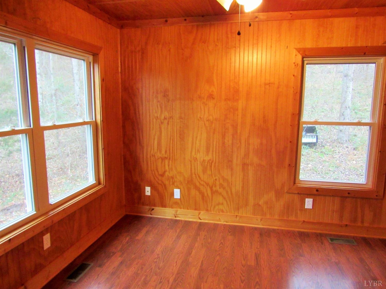 1695 Stapleton Road Madison Heights, VA 24572 - Photo 12 of 25 an empty room with wooden floor and windows