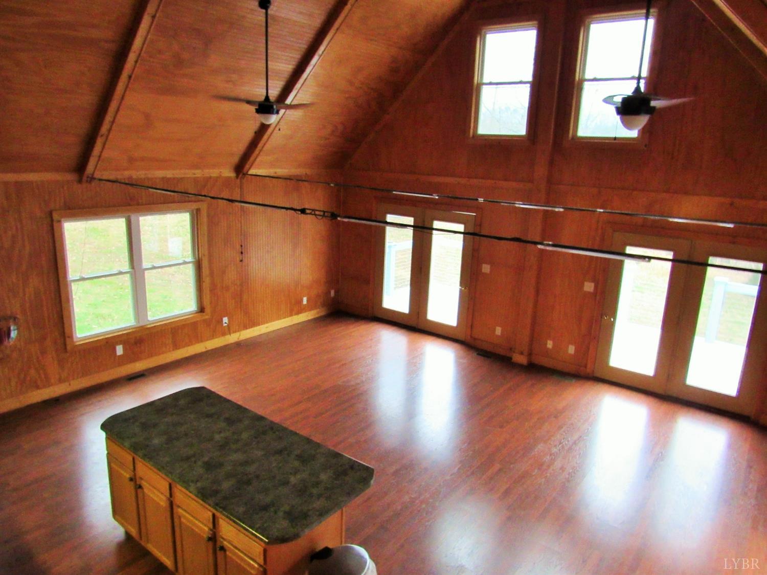 1695 Stapleton Road Madison Heights, VA 24572 - Photo 18 of 25 a view of an empty room with wooden floor and a window