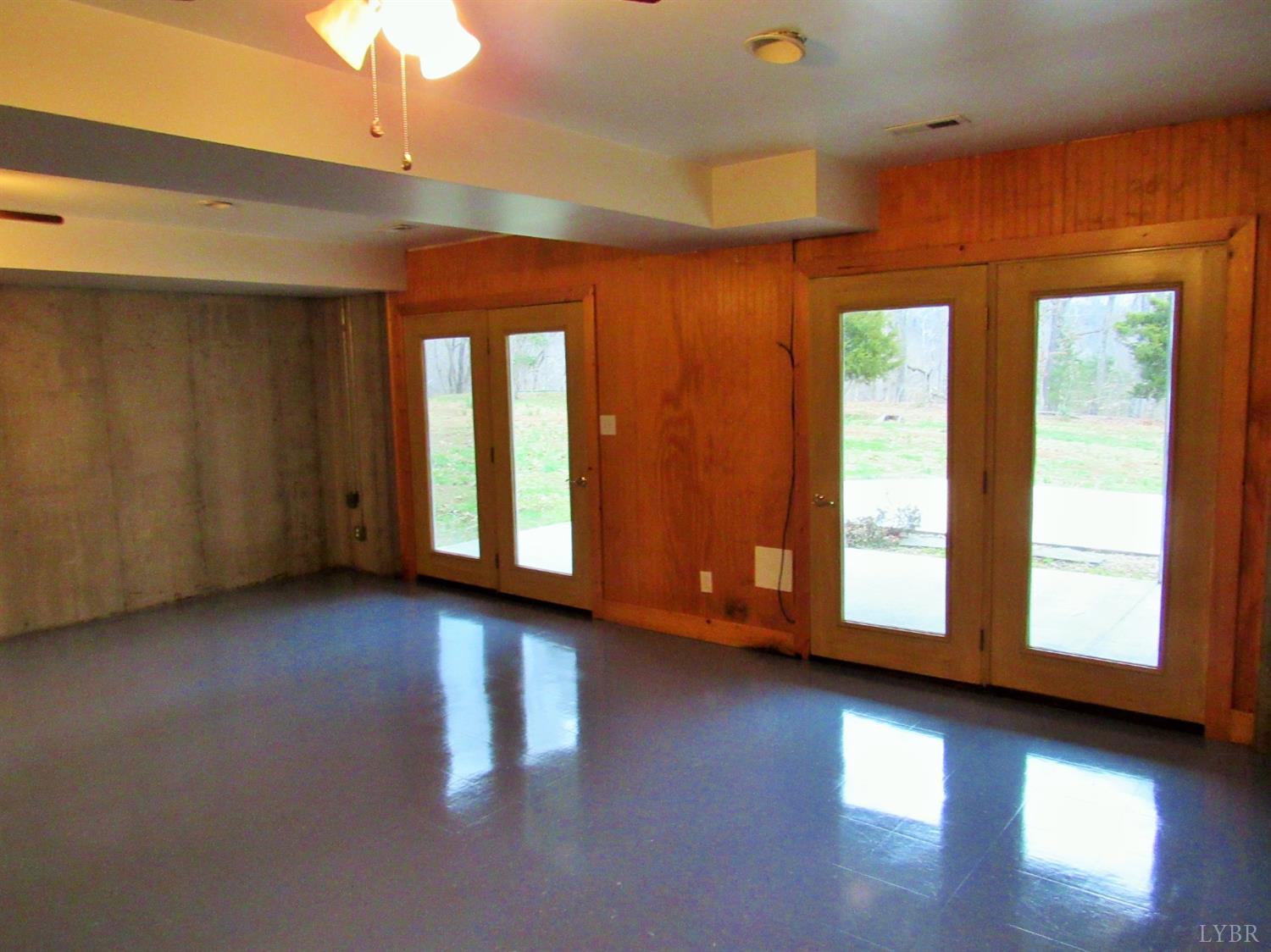 1695 Stapleton Road Madison Heights, VA 24572 - Photo 21 of 25 a view of an empty room with wooden floor and a window