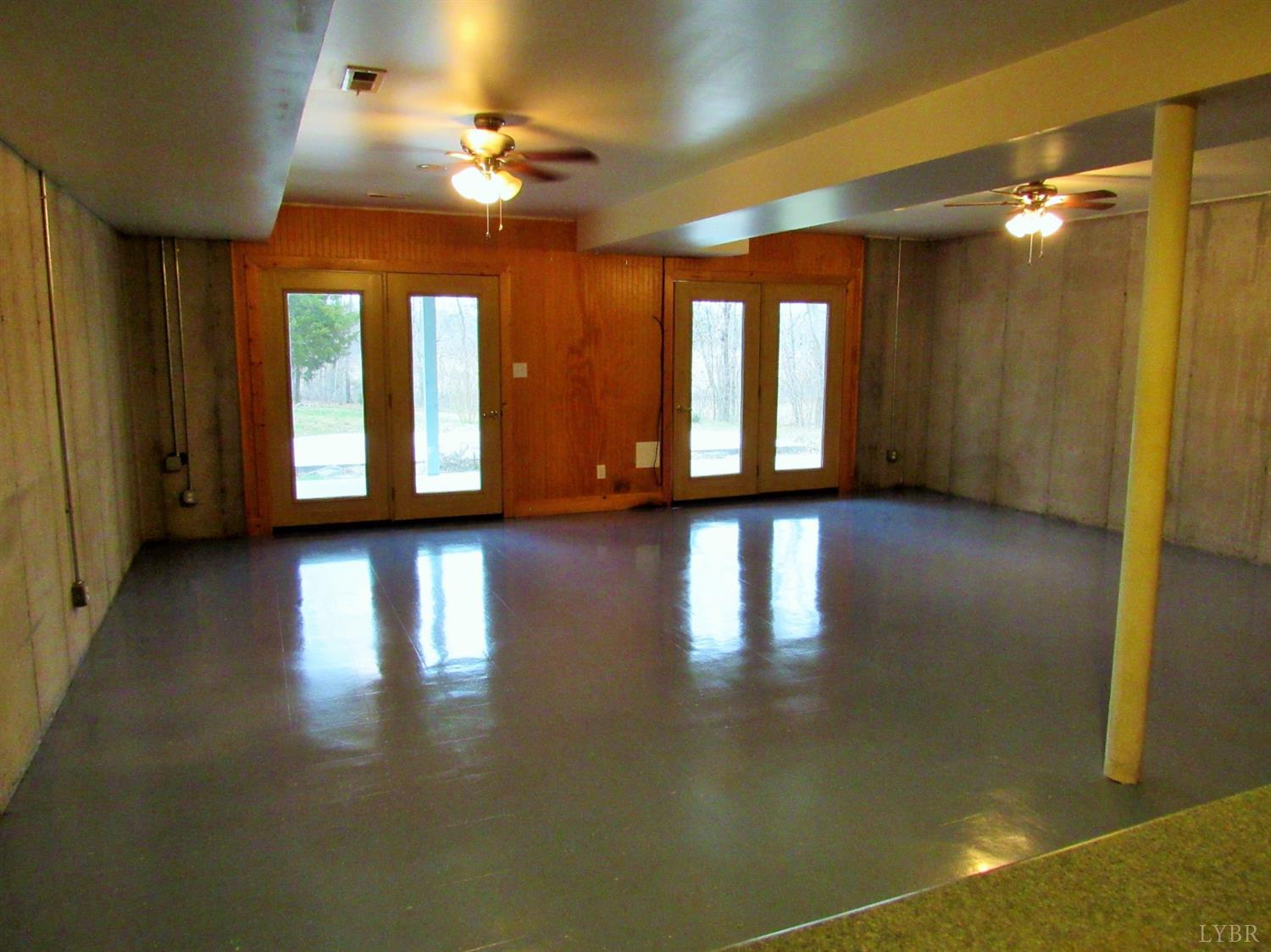 1695 Stapleton Road Madison Heights, VA 24572 - Photo 22 of 25 a view of a room with wooden floor and windows
