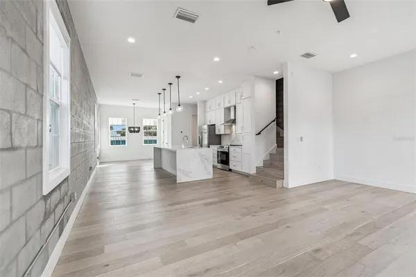 a view of a balcony with wooden floor and stairs