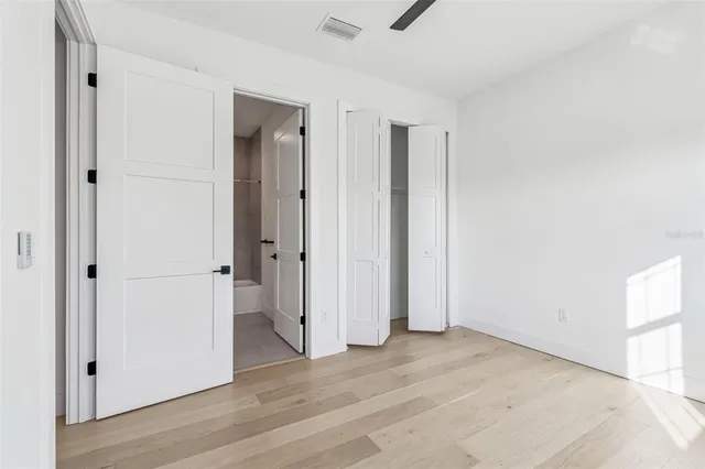 a spacious bathroom with a double vanity sink mirror and toilet