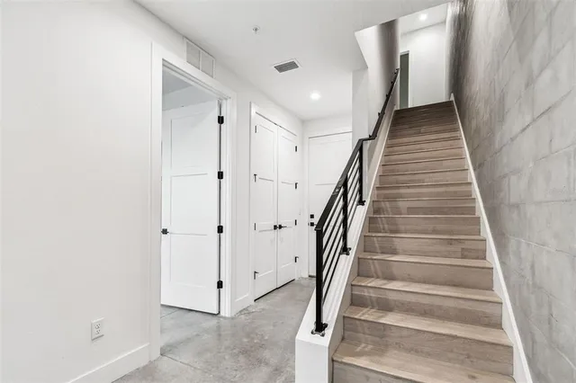a view of staircase with white walls and white walls