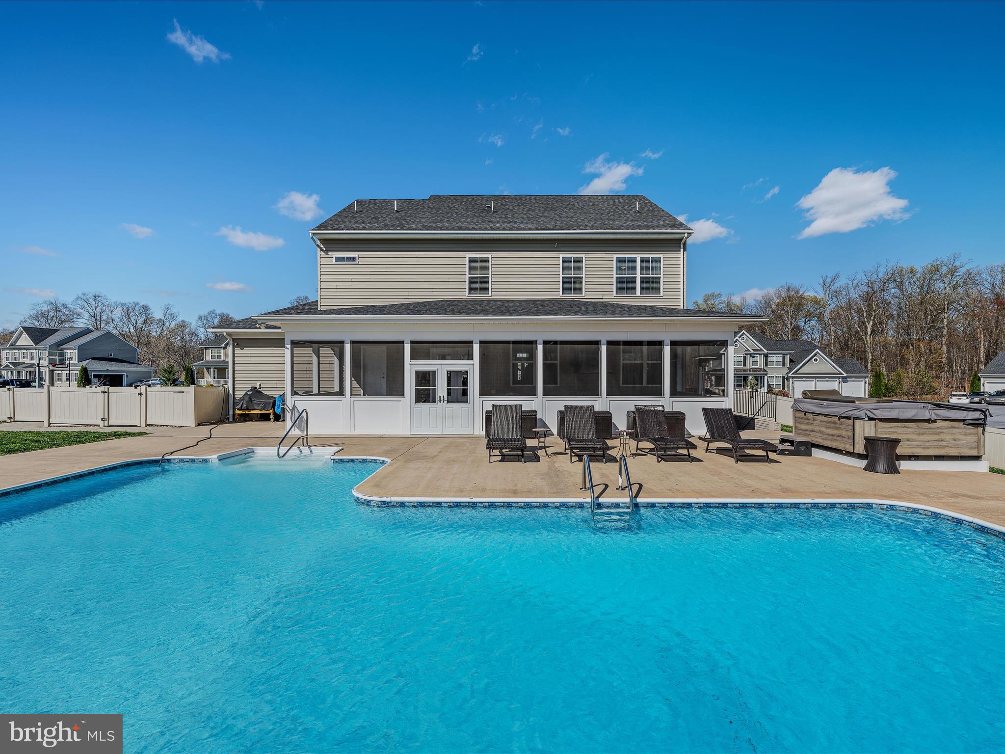 258 Tributary Trail Falling Waters, WV 25419 - Photo 61 of 89 a front view of a house with swimming pool having outdoor seating