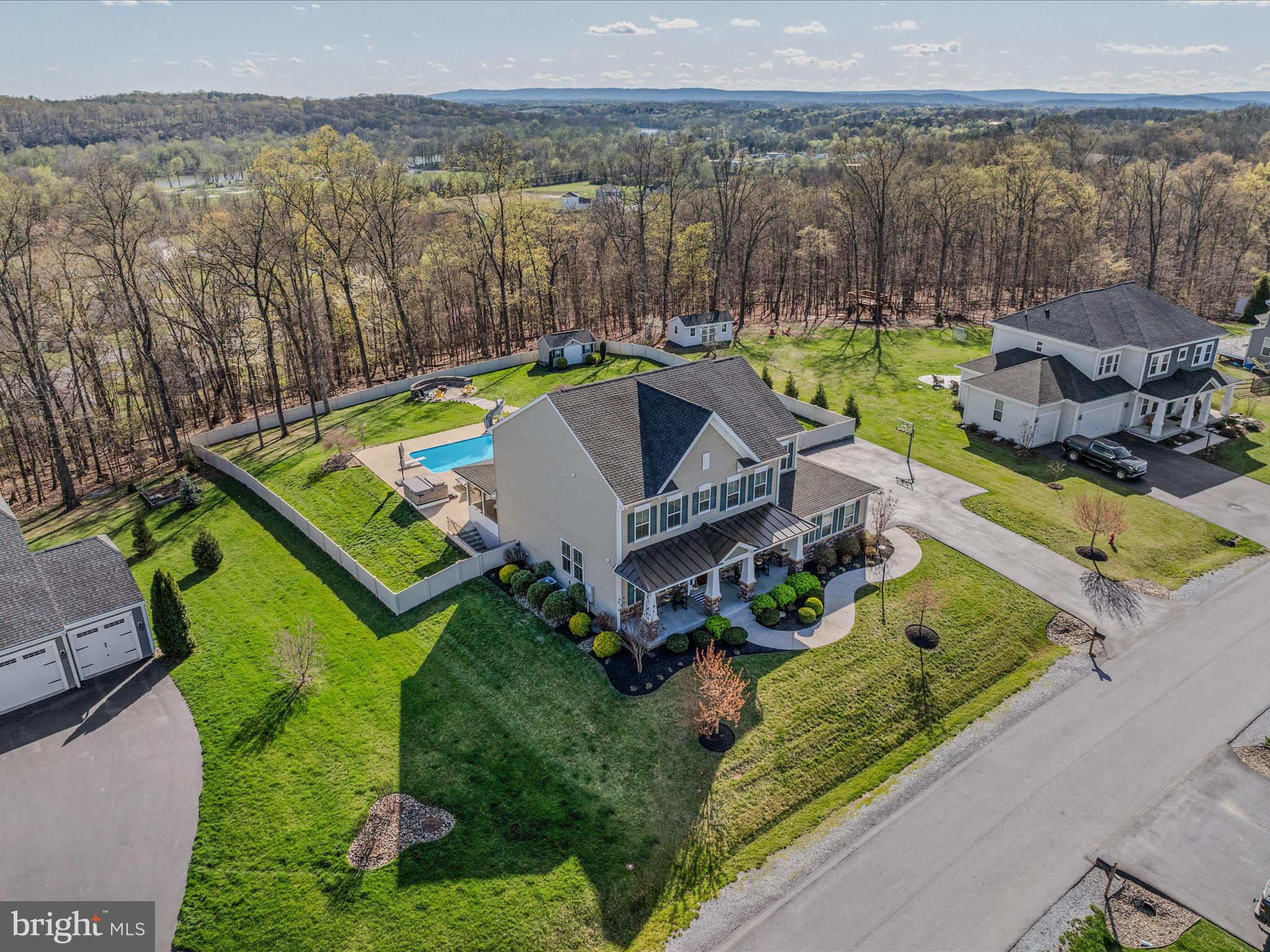 258 Tributary Trail Falling Waters, WV 25419 - Photo 81 of 89 an aerial view of a house with a garden and lake view