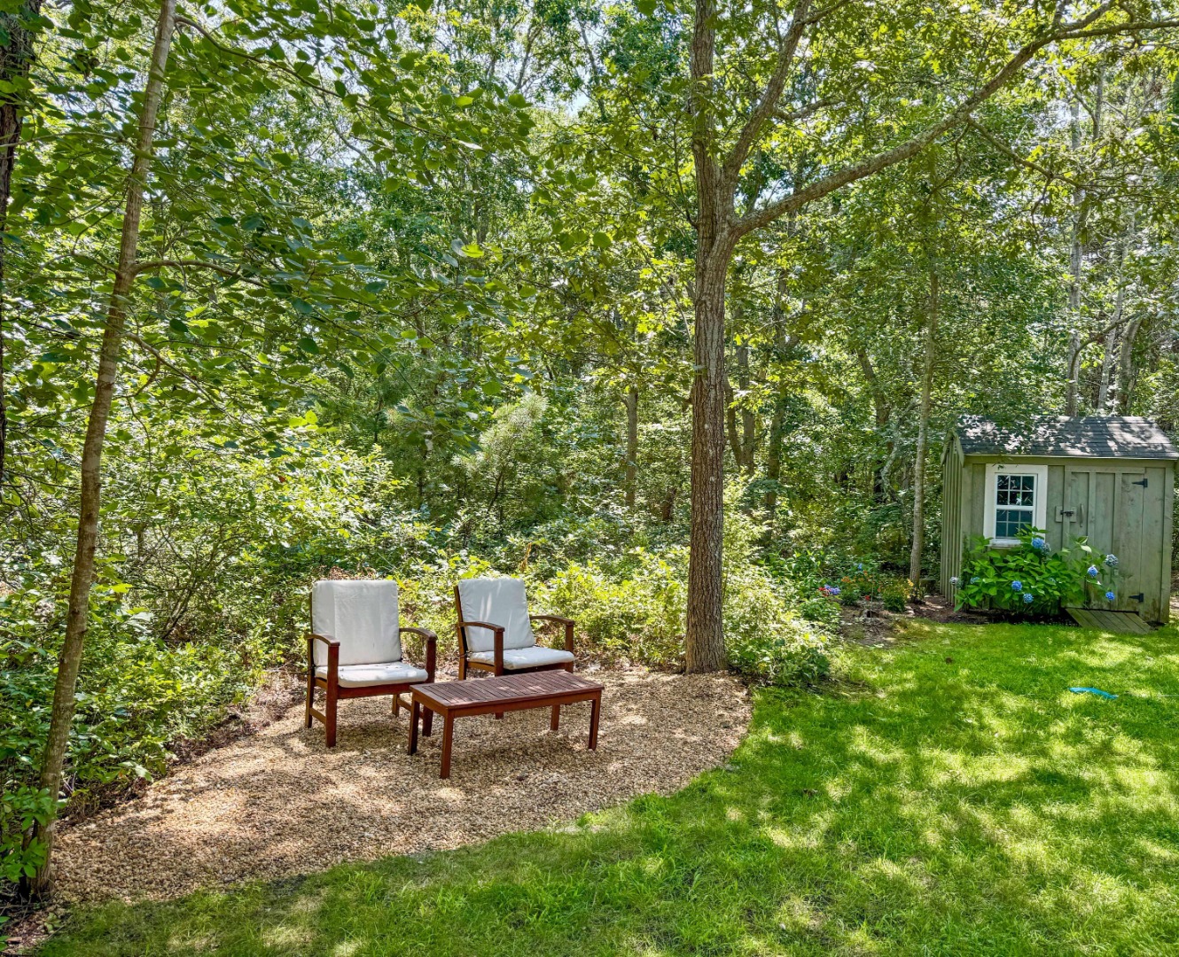 58 Rd To The Plaines Edgartown, MA 02539 - Photo 37 of 40 a backyard of a house with table and chairs