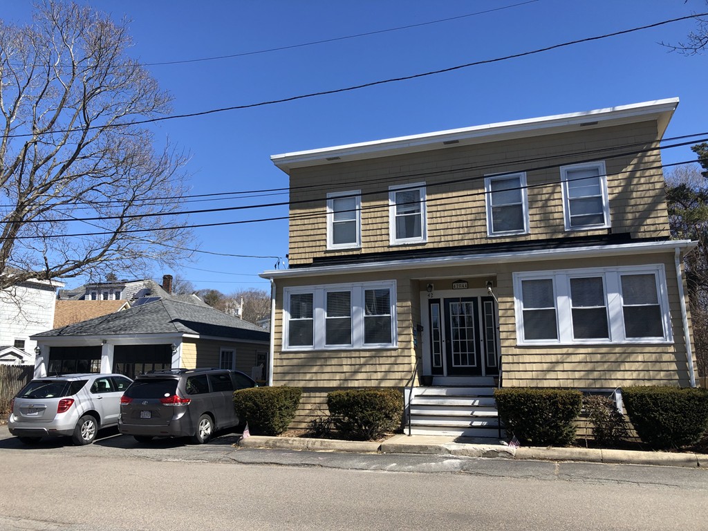 44 Sculpin Way, Unit 44 Swampscott, MA 01907 - Photo 1 of 21 a car parked in front of a house