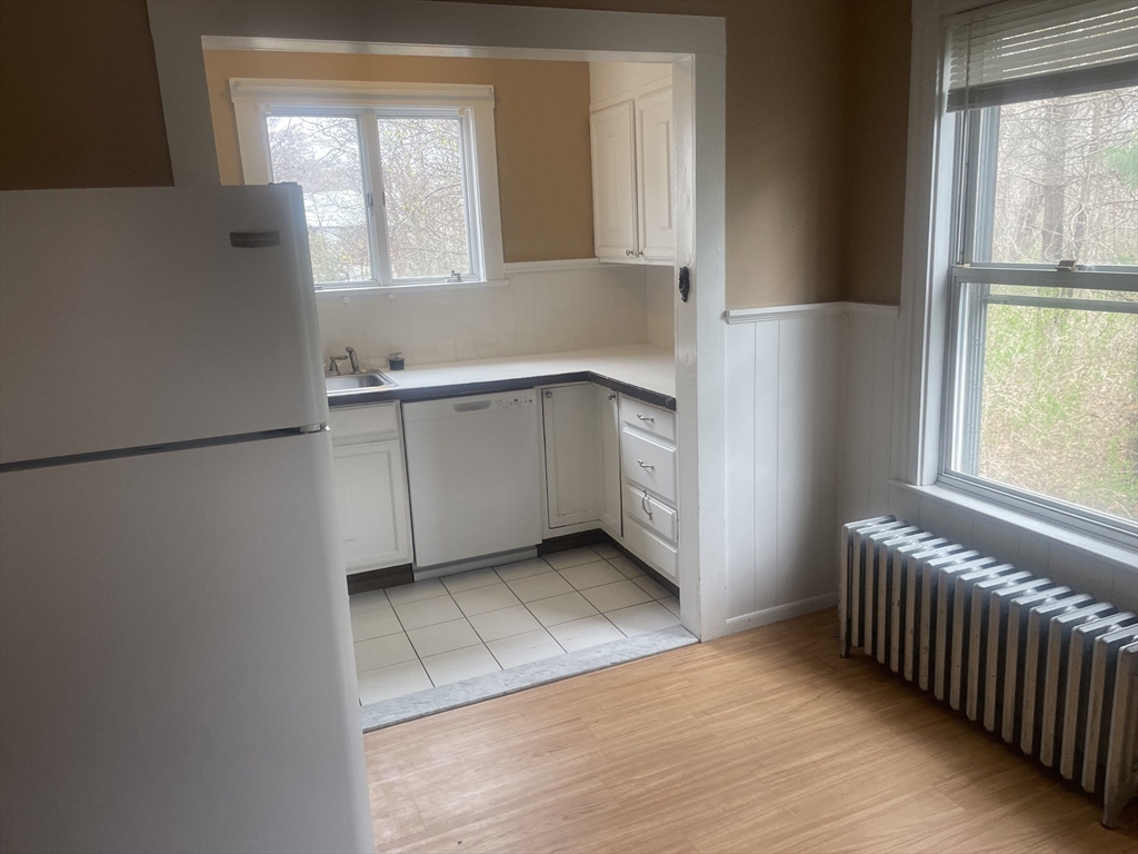 44 Sculpin Way, Unit 44 Swampscott, MA 01907 - Photo 14 of 21 a kitchen with a cabinets and window