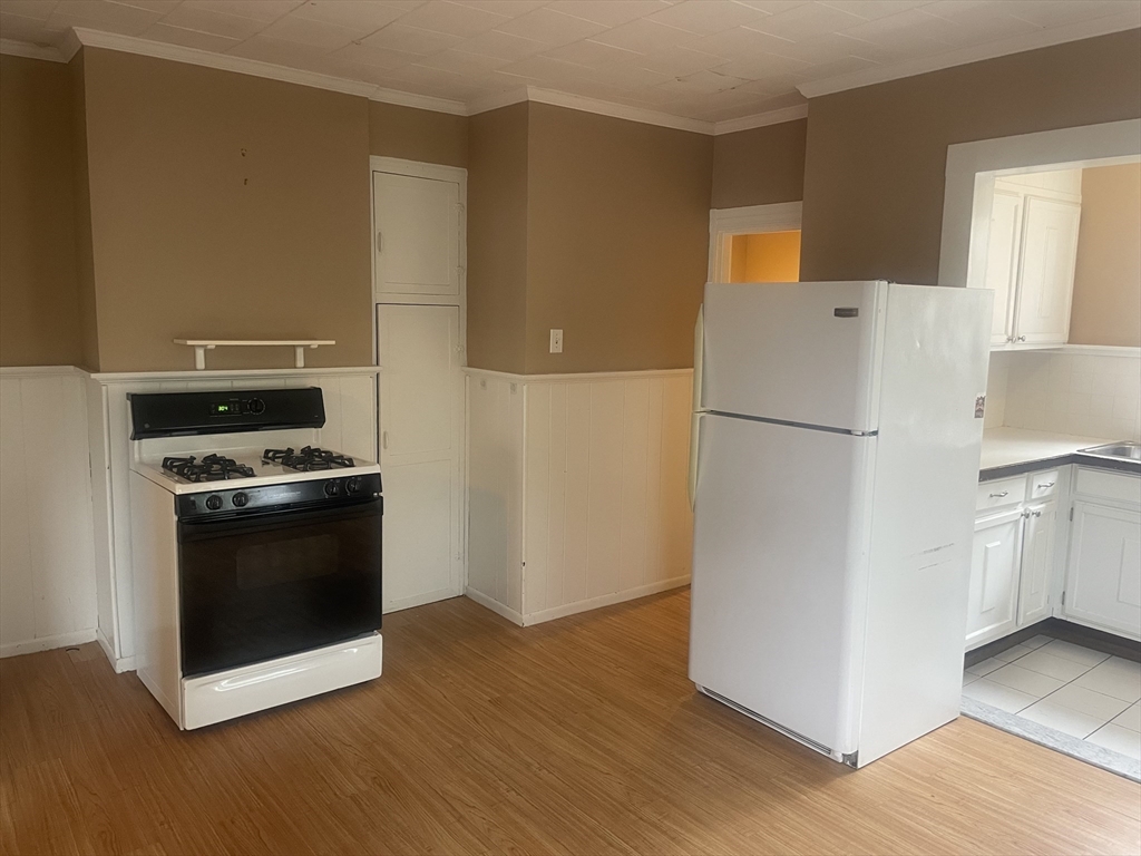 44 Sculpin Way, Unit 44 Swampscott, MA 01907 - Photo 15 of 21 a kitchen with a refrigerator and a stove