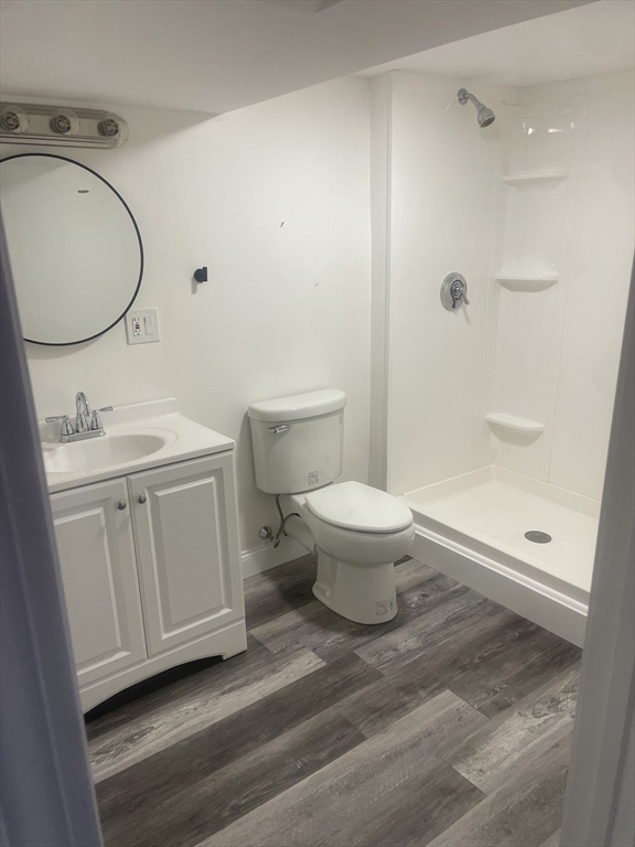 44 Sculpin Way, Unit 44 Swampscott, MA 01907 - Photo 19 of 21 a bathroom with a sink a toilet and a mirror