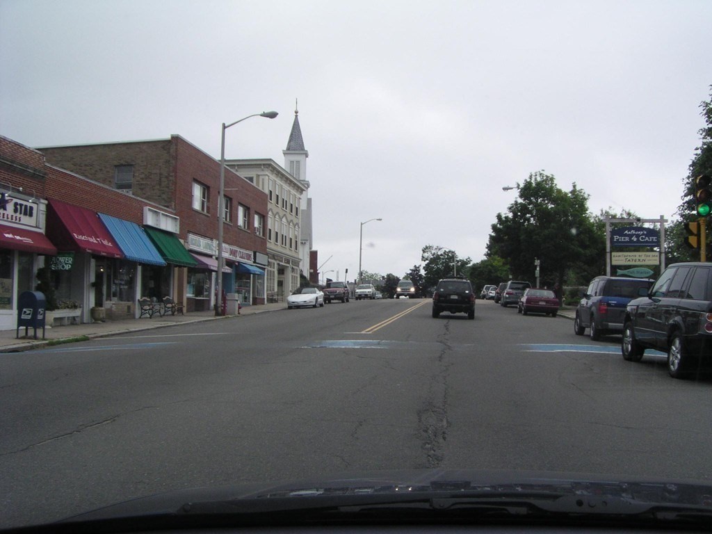 44 Sculpin Way, Unit 44 Swampscott, MA 01907 - Photo 20 of 21 a city street with cars parked in front of it